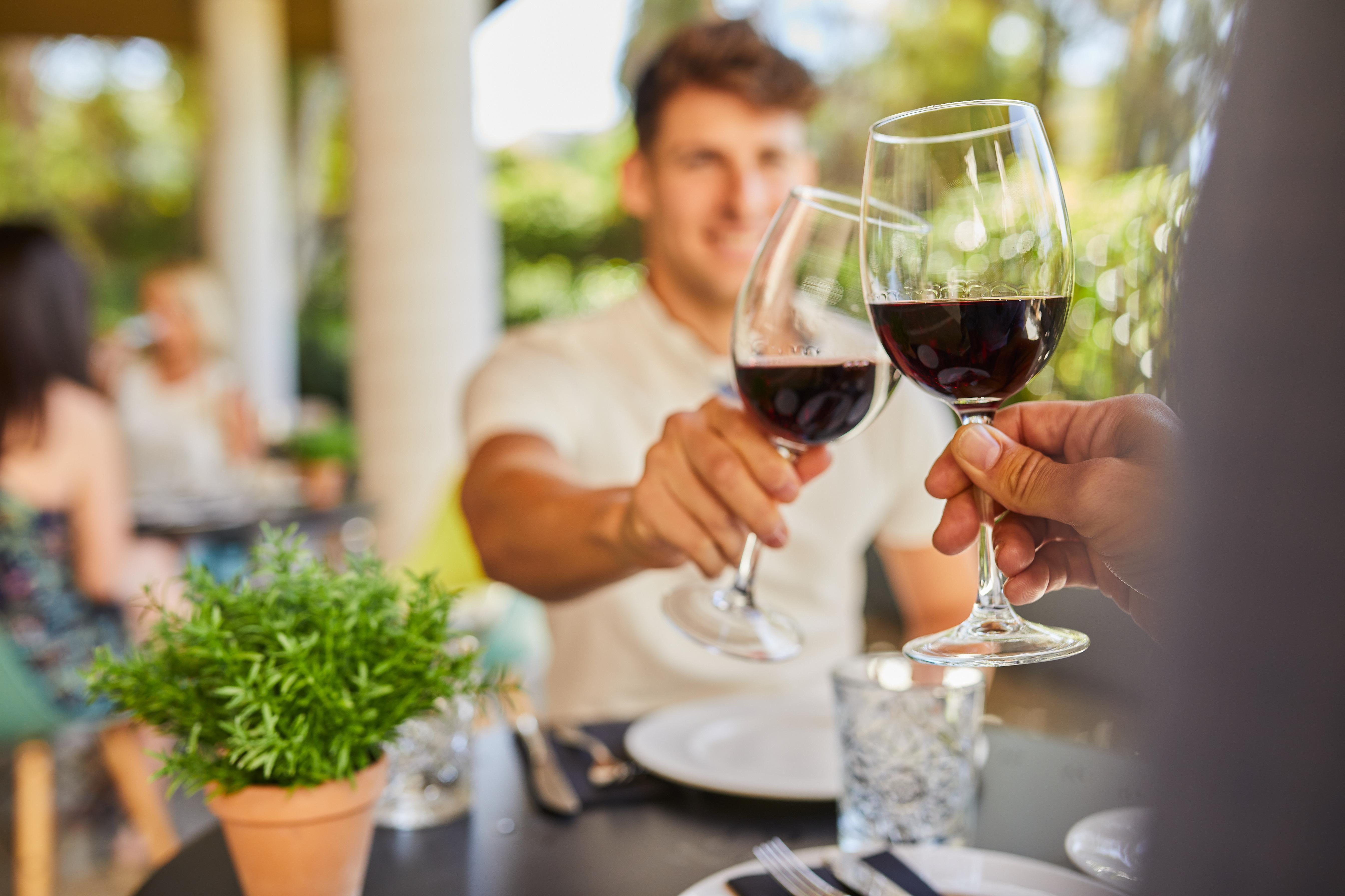 Silken Al-Andalus Palace Seville Exterior photo Two men toasting with wine glasses.